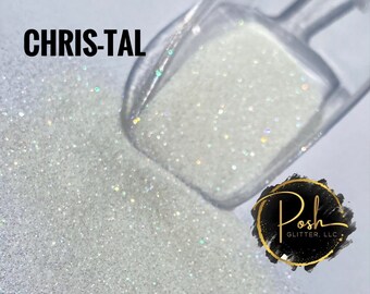 May include: Close-up of white glitter with iridescent flecks, spilling from a clear scoop. The word "CHRIS-TAL" is printed in black at the top left. A logo for "Posh Glitter, LLC" is in the bottom right.