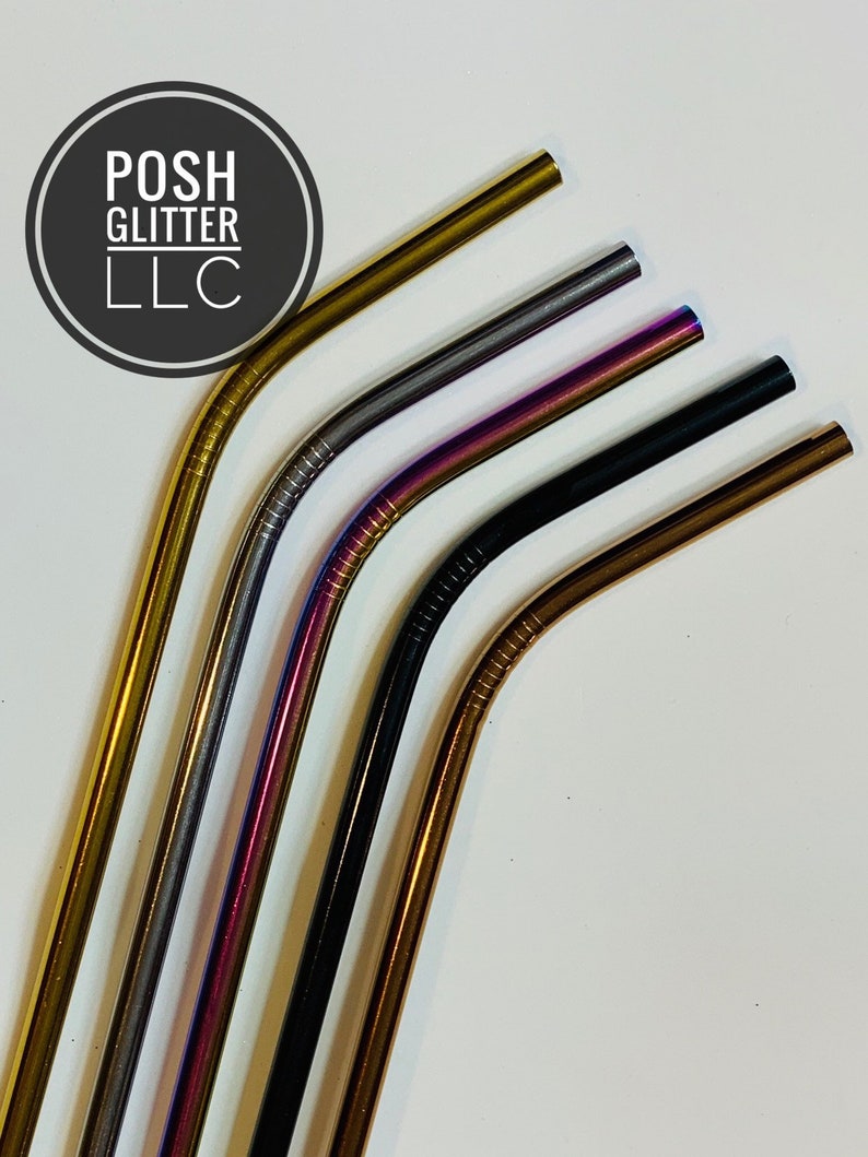 May include: Five reusable metal drinking straws in different colors: gold, silver, purple, black, and copper. The straws are bent at the top and are arranged in a fan shape.