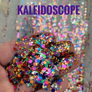May include: A handful of colorful glitter in various shapes and sizes, including circles. The glitter is a mix of vibrant colors like orange, pink, green, and purple. The word "KALEIDOSCOPE" is written in purple across the top of the image.