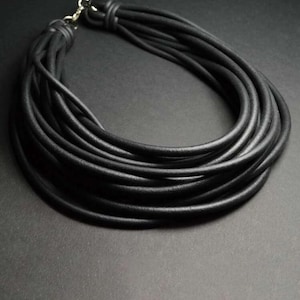 Black rubber necklace, multi threaded, with rubber thick threads. Lobster thread fastener.