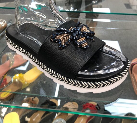 Black bee sliders, sizes 3-7. (36-41) Black with white sole.