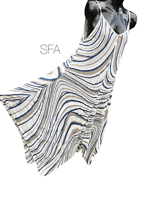 Strappy sundress, with handkerchief hem. One size reg, 12 14, 16, 18. 5 colours