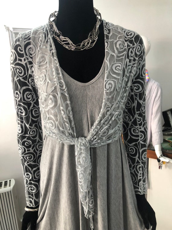 Belero or shrug,in net knit, perfect as a cover up. Size medium to large