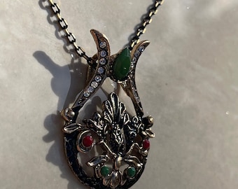 Vintage style emerald green, red and brass necklace and earrings.