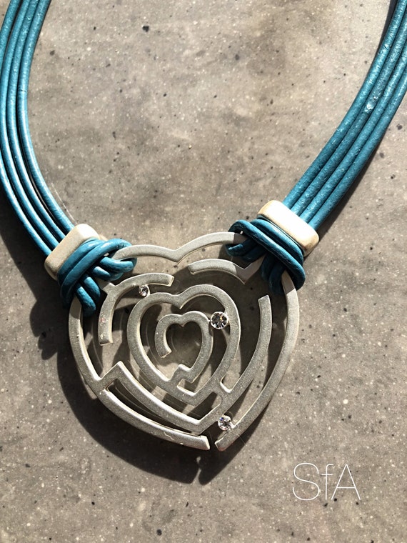 Modern Blue Multi Cord Matt Silver and diamante Heart Pendant Necklace.
