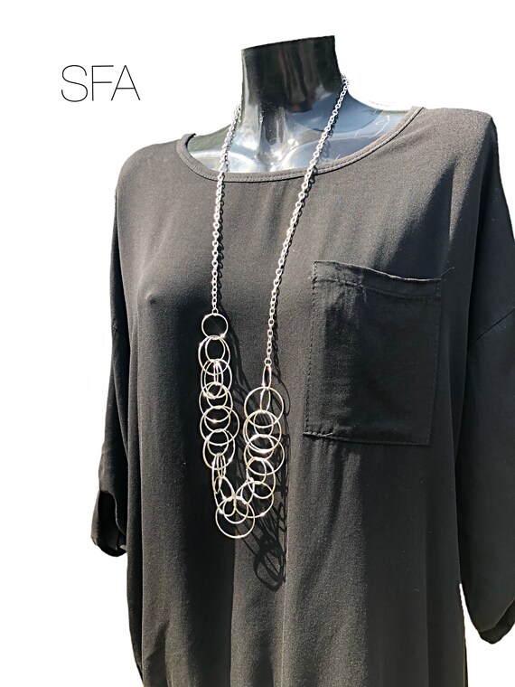 Stunning long necklace, inter looped different sized circles, geo chain, in silver alloy.