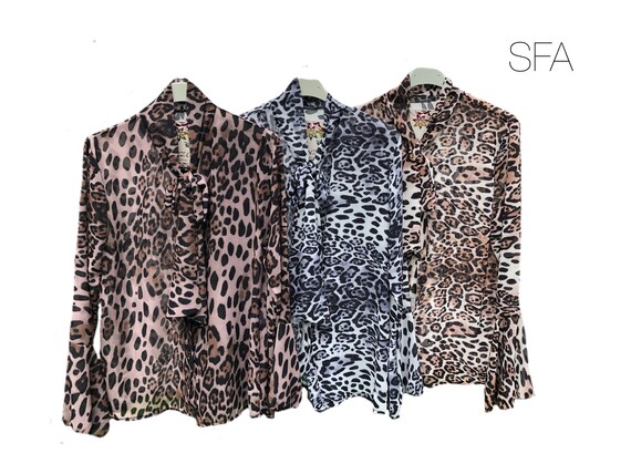Animal print blouse, with pussy bow and flred sleeves, size 8-16. In 3 different colours