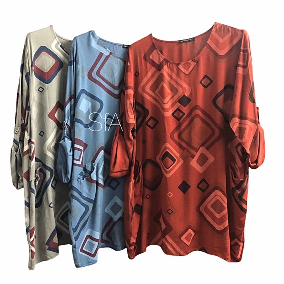 Tunic with geometric shapes, with pockets, turn up sleeves, that drop to long. Size 12, 14, 16, 18 size 2XL