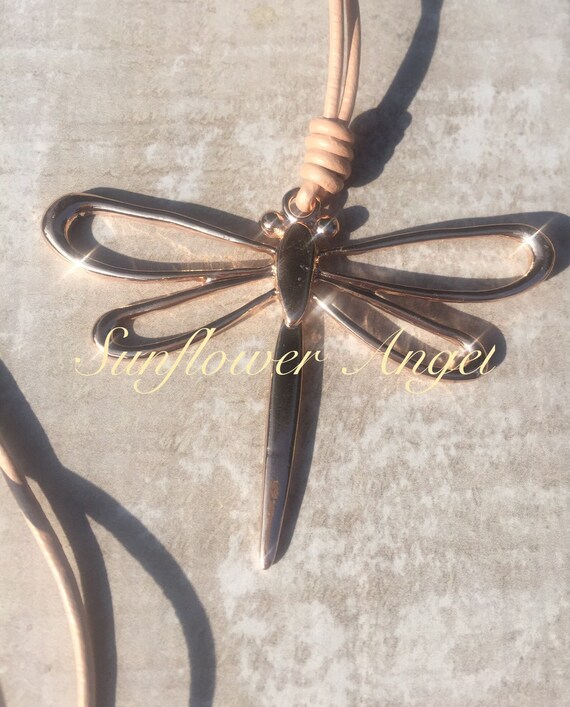 Lagenlook, fabulous rose gold dragonfly necklace, on long shimmering honey cream leather necklace.