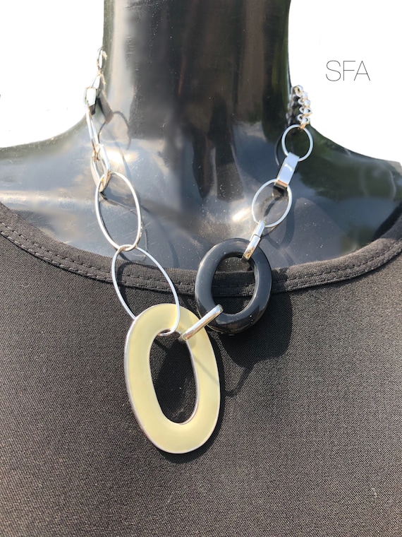 Geo large oval cream enamelled necklace, with black acrylic oval, on a silver belcher chain with lobster clasp and extension chain