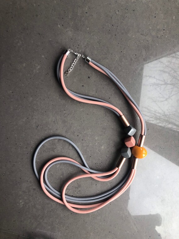 Lagenlook rubber necklace, pink and grey multi-strand, with orange bead.