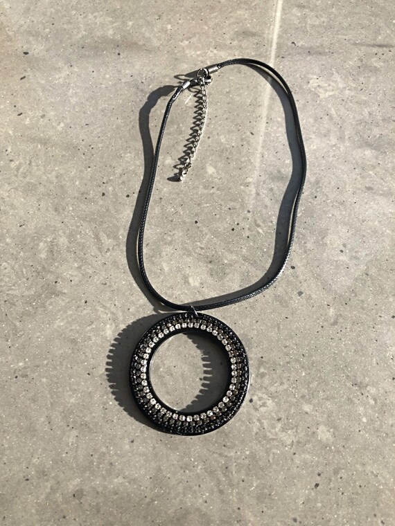 The Taylia geo large acrylic and crystal necklace, on a black coated cord.