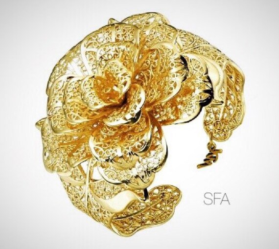 The Alexis gold plated flower bangle, adjustable
