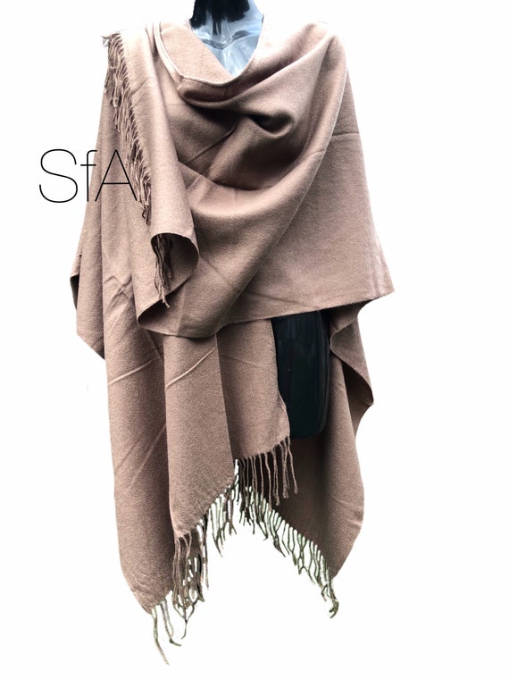 Long tassle shawl, with split neck and long drop. In 3 different colours.