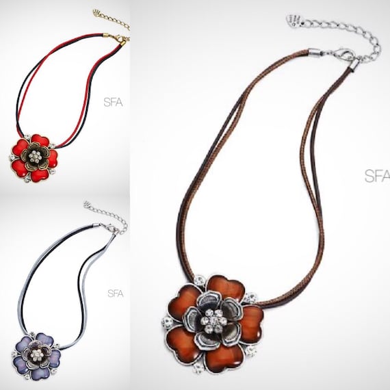 The Fluer enamel flower necklace, on a multi strand 2 tone cord thread, in red, vintage lilac or honey brown