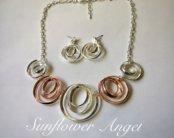 Geo small and large interlooped gold and silver tone circular multi thread necklace and matching earring set.