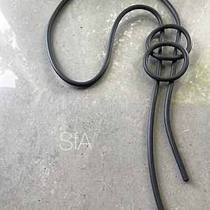 Thick foam rubber necklace, with matching circles.