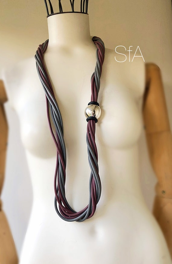 Rubber necklace, multi thread. In twisted grey and mauve, with silver acrylic ball.