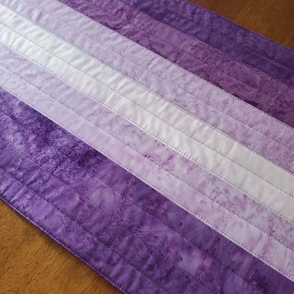 Modern quilted batik table runner, linear value gradations of purple