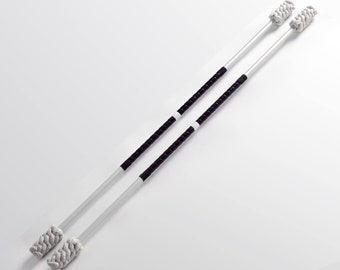 May include: Two white fire staffs with black tape and white rope ends. The staffs are laid out parallel to each other on a white background. The text "FURIA STUDIO" is printed in orange at the bottom of the image.