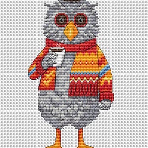 May include: Cross-stitch design of a gray owl wearing a red and patterned scarf and sweater, holding a cup of coffee. The owl has orange feet and a yellow beak. The background is white.