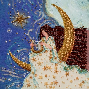 May include: A woman with long brown hair plays a harp while sitting on a crescent moon. The moon and the woman's dress are decorated with gold and white beads, creating a starry night scene.