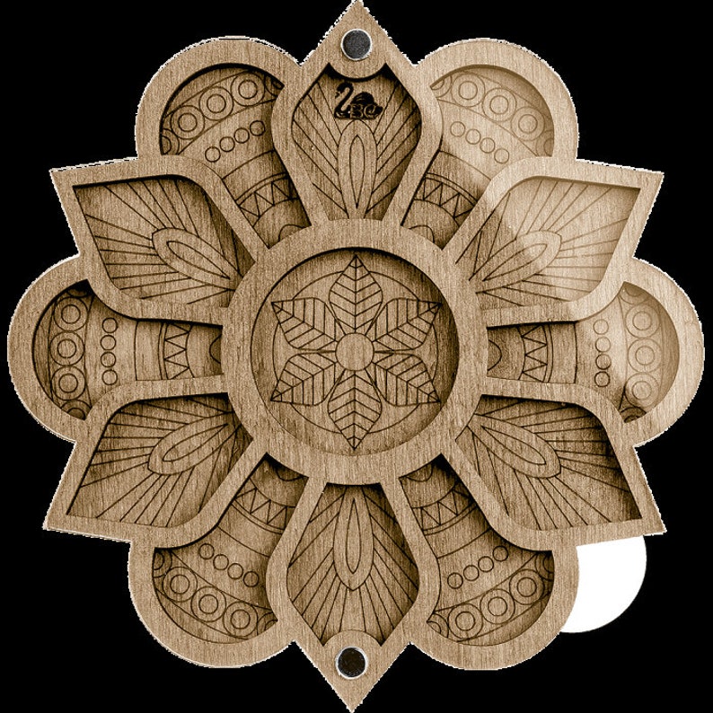 May include: A wooden mandala-shaped box with a flower design and a small circular opening in the center. The box is made of light brown wood and has a detailed design.