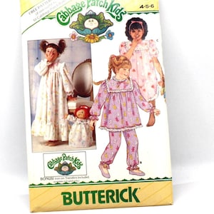 May include: A vintage Butterick sewing pattern featuring Cabbage Patch Kids. The pattern includes illustrations of children's sleepwear and pajamas. The packaging is yellow and white, with the Cabbage Patch Kids logo and the text "4139 Size 4-5-6".