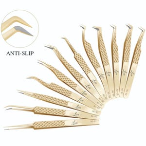 May include: An assortment of gold-toned eyelash extension tweezers with textured handles. The tweezers feature different tip designs and are marked with "Liva" and "AG" codes. The image also displays the text "ANTI-SLIP".
