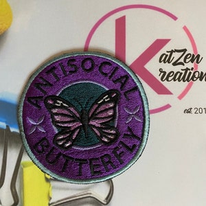 May include: Purple embroidered patch with a butterfly and the text "Antisocial Butterfly".