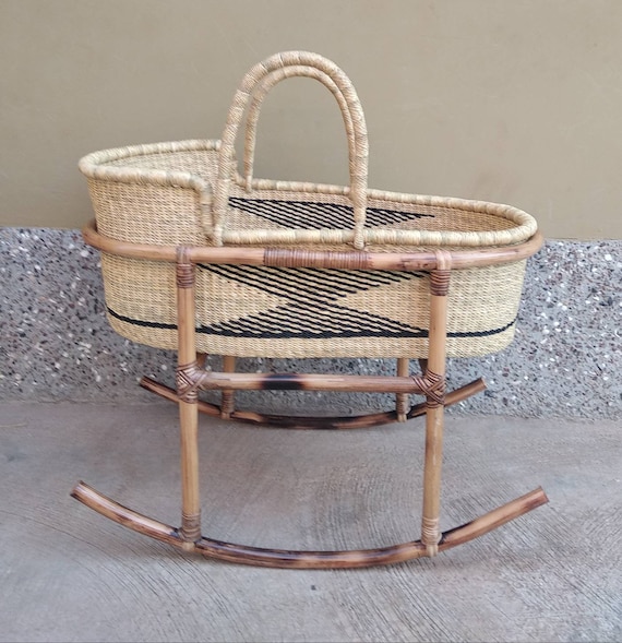 moses basket in bed