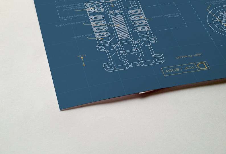 May include: A blueprint style illustration of a device with the text "TOP / BODY" and "NOT TO SCALE" in yellow. The device is labeled with various components, including "ACCU-SENSE ENABLE", "COOLING VENT", "PROCESSOR MODULE", "FAST TANK PRESSURE", "ANTI-GRAVITY RESISTOR", and "TENSION DAMPER".