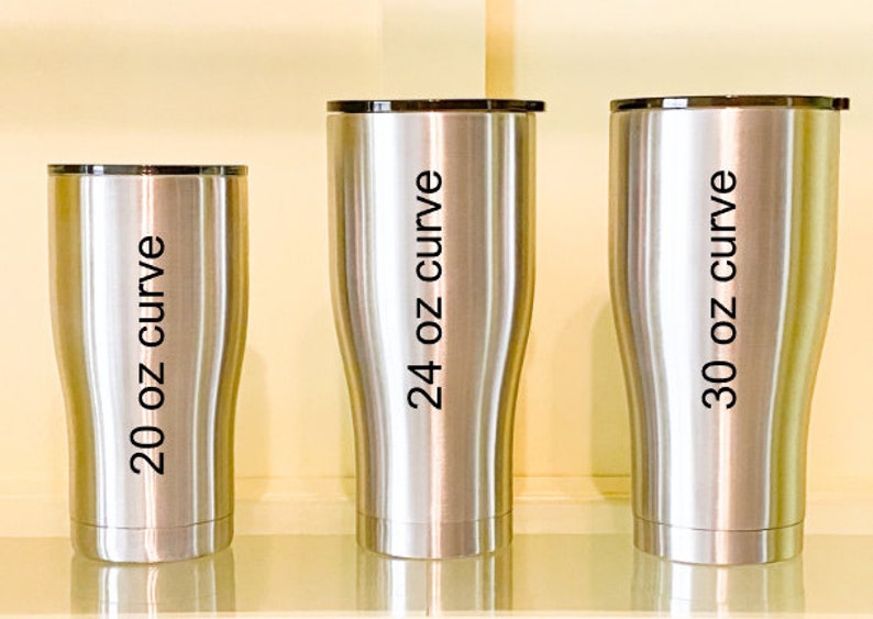 May include: Three stainless steel tumblers with black lids. The tumblers are labeled with the text "20 oz curve", "24 oz curve", and "30 oz curve".