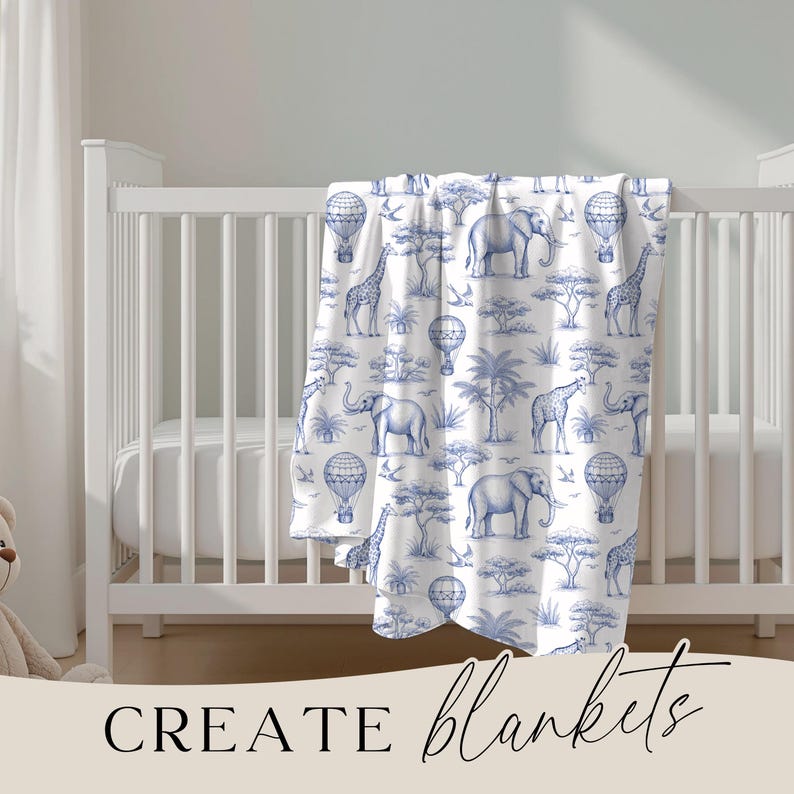 May include: A white baby blanket with a blue safari animal print, including elephants, giraffes, and hot air balloons. The blanket is draped over a white crib. The words "CREATE blankets" are at the bottom.