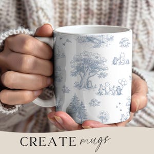 May include: White ceramic mug featuring a blue toile design with woodland creatures and trees. The mug has a handle and the words "CREATE mugs" are printed at the bottom. The mug is held by a person.