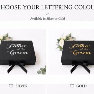 May include: A black rectangular gift box with a black ribbon bow on the front. The lid features the text "Father of the Groom" in either silver or gold lettering. The text "CHOOSE YOUR LETTERING COLOUR" and "Available in Silver or Gold" appears above.