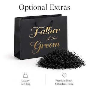 May include: A black gift bag with the gold text Father of the Groom printed on the front, featuring black cord handles and a pile of black shredded tissue paper. The text Optional Extras appears at the top, with icons and labels below.