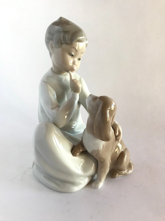 lladro boy sitting with dog