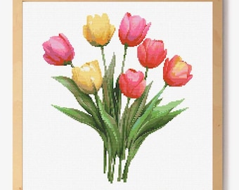 May include: A framed watercolor painting of a bouquet of pink and yellow tulips with green leaves.