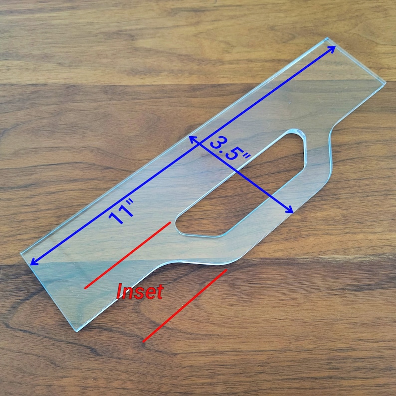 May include: A clear plastic template for making an inset, measuring 11 inches long and 3.5 inches wide. The template has a cutout for a handle.
