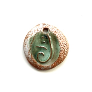 May include: A set of three ceramic mugs with a speckled, matte finish. The mugs are in shades of cream, light gray, and dark gray. Each mug has a simple, minimalist design, perfect for coffee or tea.