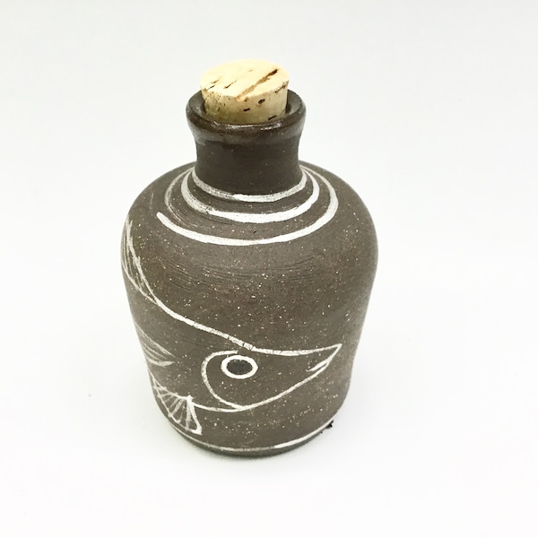 Unglazed rustic pottery bud vase, ceramic vase with a fish drawing, small pottery bottle with a cork stopper, small pottery vase