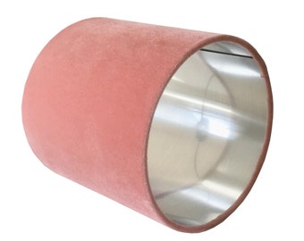 May include: A dusty rose pink velvet lampshade with a silver lining.