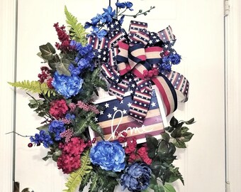 Americana grapevine floral wreath is farmhouse style, star spangled, all season and red white and blue, perfect for patriotic holidays!