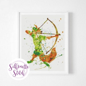 May include: A cross-stitch pattern of a green and orange silhouette of Robin Hood holding a bow and arrow. The background is white with splashes of color.