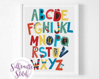 May include: A colourful alphabet chart with each letter decorated with a different monster design. The letters are in a white frame.
