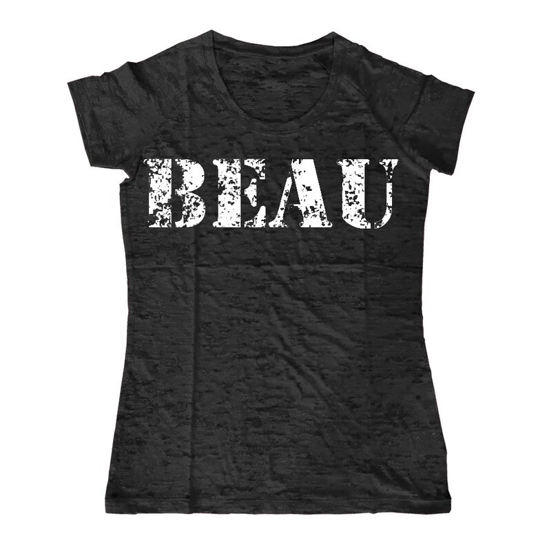 May include: Black t-shirt with a white distressed font that reads "BEAU".