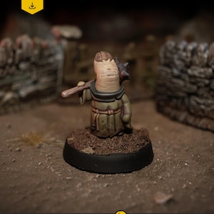 May include: A miniature figure of a fantasy character, holding a weapon. The figure is painted in shades of tan, green, and brown, with a black base. The image includes the text "DIGITAL DOWNLOAD .stl files".