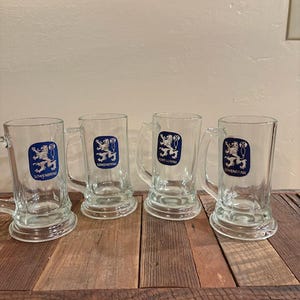 Set of 4 Lowenbrau Glass Beer Mugs With Handles and Blue Emblems