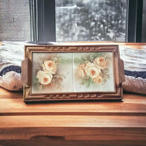 May include: A wooden tray with a carved border and two ceramic tiles featuring hand-painted yellow roses.